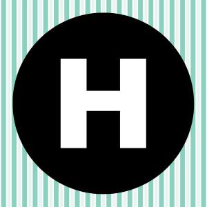 Image of a white letter H inside of a black circle with a teal and white striped background.