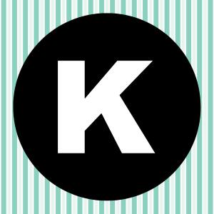 Image of a white letter K inside of a black circle with a teal and white striped background.