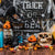 Image of a Halloween themed setup, with a mix of decorations and props including spiders, webs, skulls, pumpkins and gravestones.