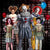 Image of 3 adults and 2 kids wearing different Pennywise the Clown costumes.