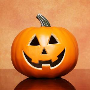 Image of an orange Halloween Jack-o'-lantern pumpkin decoration.