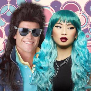 Image of a man and woman wearing costume wigs priced $41 to $55, one is a brown mullet style and one is a blue and teal ombre wig with waves and a fringe.