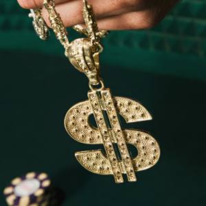 Image of a gold dollar sign costume necklace