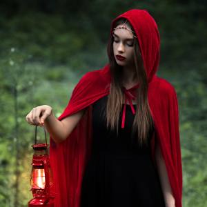 Image of a woman wearing a red cape