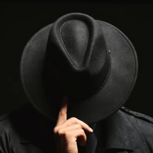 Image of a person wearing a black hat