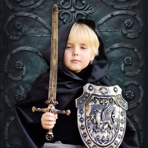 Image of a boy with a costume sword weapon