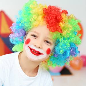 Image of a kids wearing a rainbow afro wig