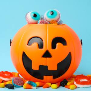 Image of a jack o lantern trick or treat bucket with lollies