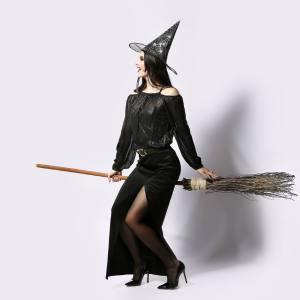 Image of a woman dressed as a witch with a broomstick