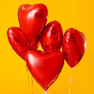 Image of red heart shaped foil balloons