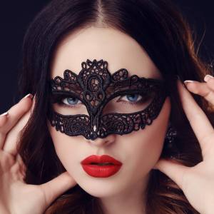 Image of a woman wearing a lace masquerade mask