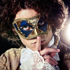 Image of a man wearing a masquerade mask