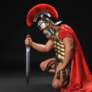 Image of a man in a gladiator costume with a fake sword