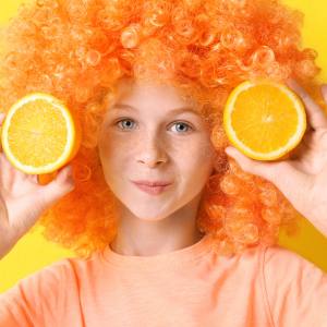 Image of a girl wearing an orange wig