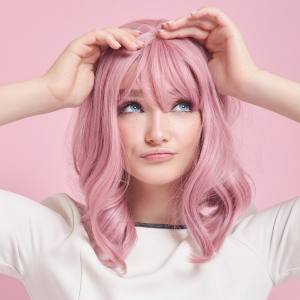 Image of a woman wearing a pink costume wig