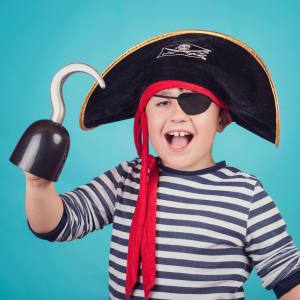 Image of a boy wearing pirate accessories