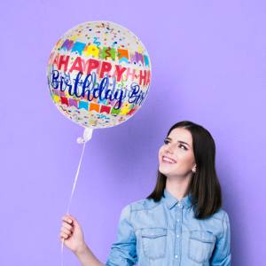 Image of a woman holding an inflated printed balloon