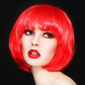 Image of a women wearing a red wig