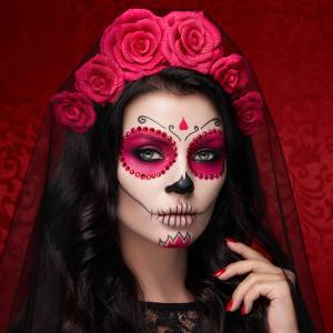 Image of a woman with sugar skull face paint and accessories