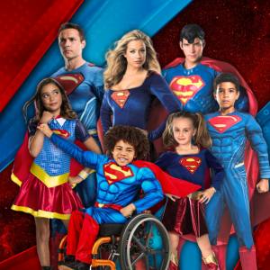 Image of people in superman costumes