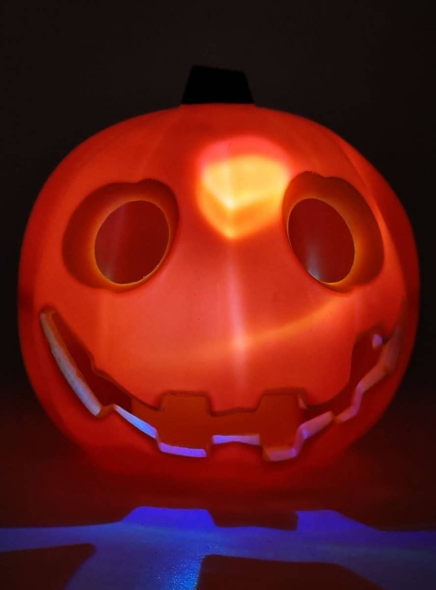 Image of Mini Orange Friendly Light Up Pumpkin Halloween Decoration - Lit Image