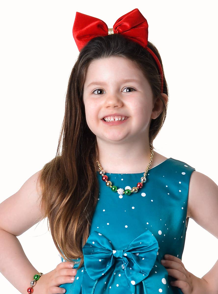 Image of Deluxe Girl's Teal Santa Print Christmas Dress - Close Front View