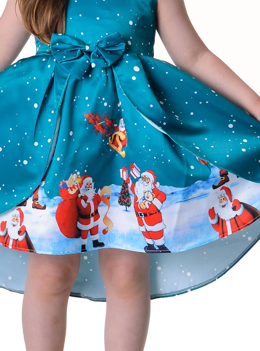 Image of Deluxe Girl's Teal Santa Print Christmas Dress - Close Skirt View