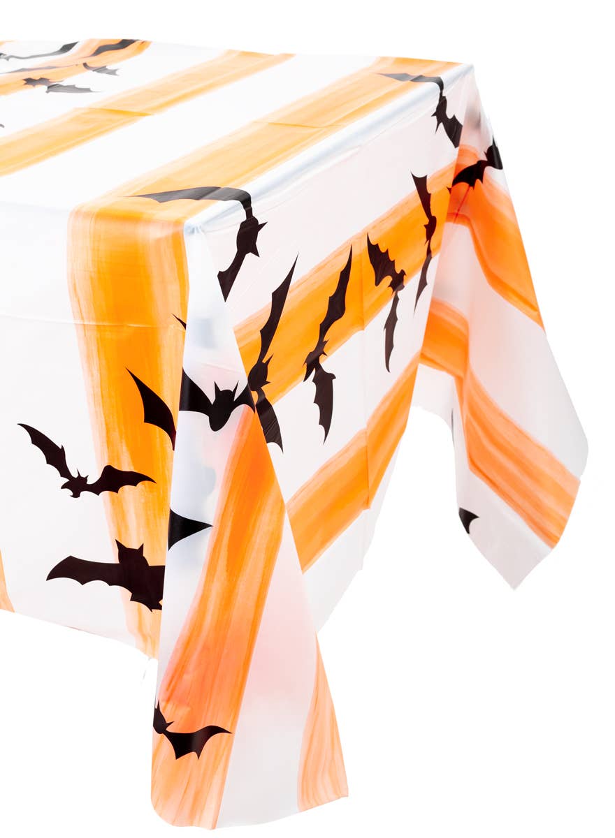 Orange and White Striped Plastic Halloween Table Cover with Black Bat Print