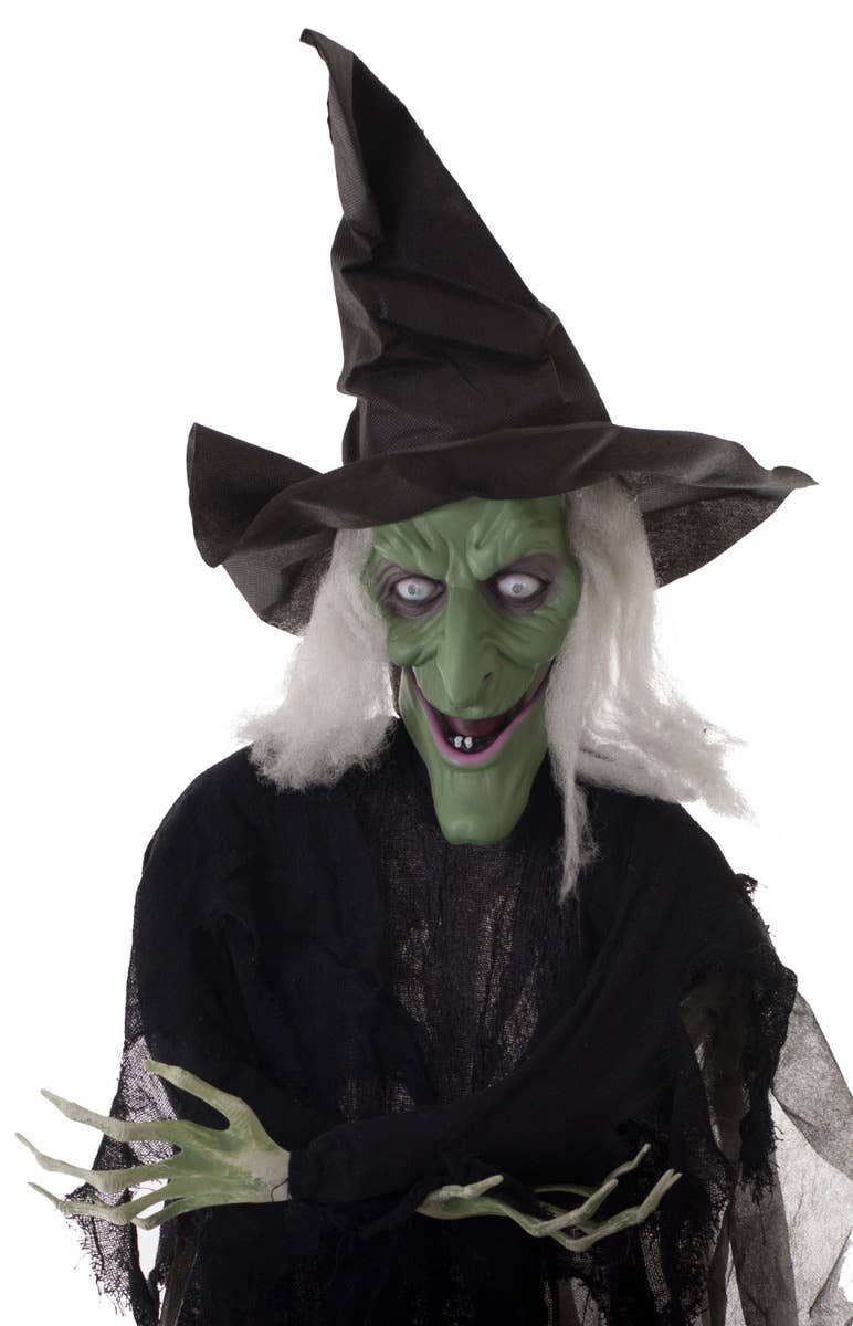 Black Haunted House Halloween Wicked Green Talking, Moving And Light Up Witch Decoration Close Up Image 